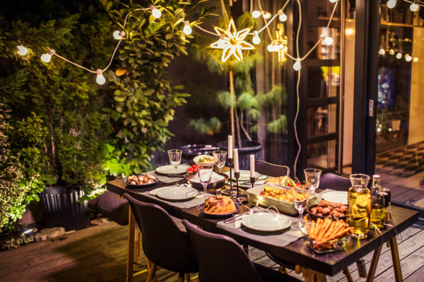 Table ready for dinner party Table ready for dinner party at house backyard garden lights candle stock pictures, royalty-free photos & images