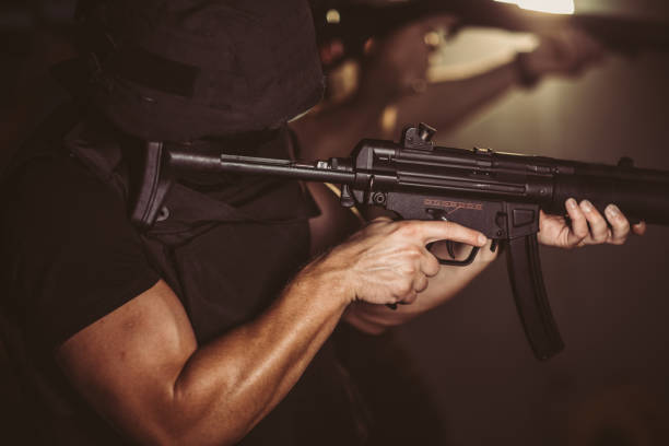 istock Police special forces man aiming with rifle 1181201021