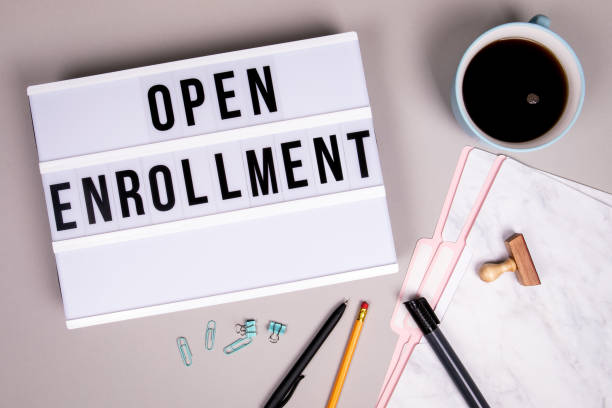 Open Enrollment concept. White lightbox Open Enrollment concept. White lightbox on a gray office desk registration form photos stock pictures, royalty-free photos & images