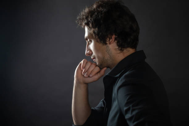 istock Young thoughtful handsome man with a light stubble on his face. 1181203813