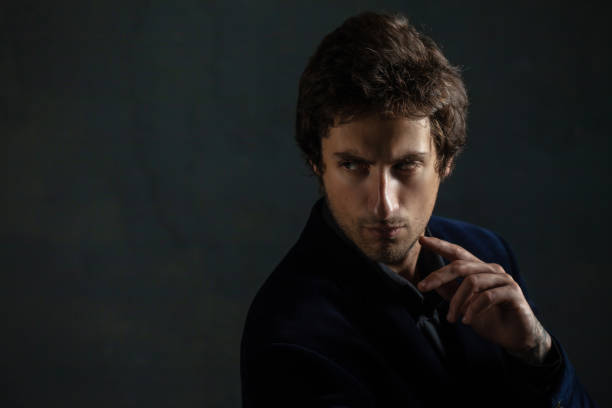 istock Young thoughtful handsome man with a light stubble on his face. 1181203935