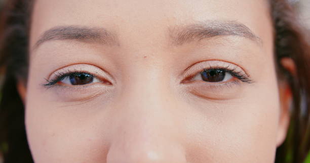 istock Asian Lady's Eyes Blinking Outdoors 1181204438