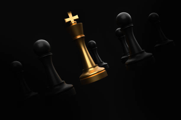 istock Golden King surrounded by black pawns - chess trap concept 1181204691