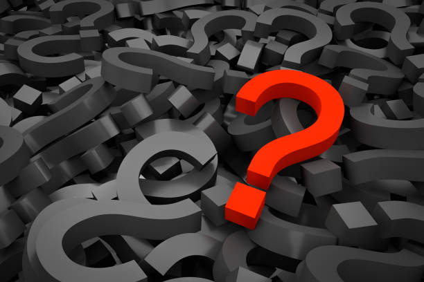 istock Red question mark on background of black question marks 1181206610
