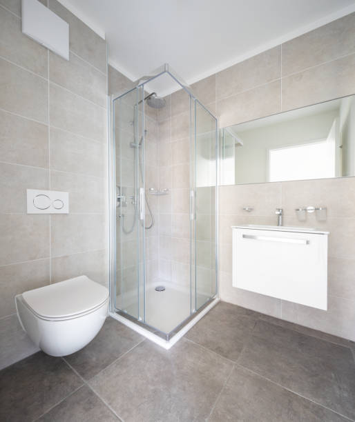 istock Modern minimal bathroom with large tiles and shower 1181207344