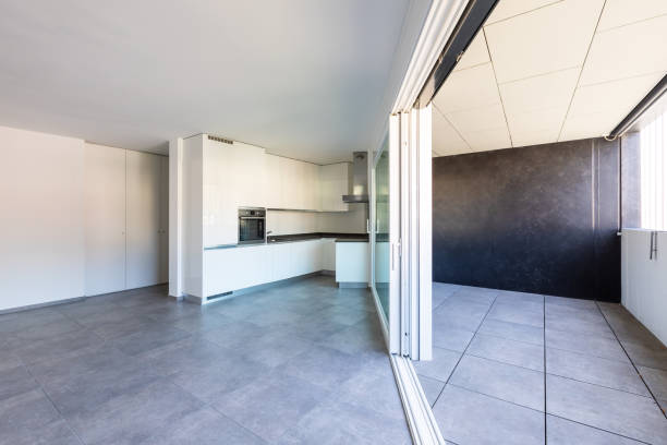 istock Modern white kitchen in empty apartment with white walls 1181207354