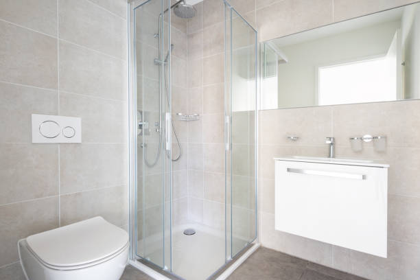 istock Modern minimal bathroom with large tiles and shower 1181207452