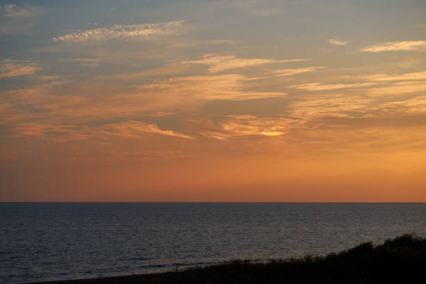 istock Dramatic Sky With Iridescent Clouds At Sunset By Beach In Greece 1181207778