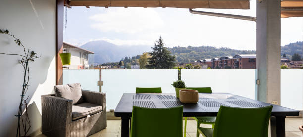 istock Front terrace view with furniture. Table, chairs and potrona. 1181208014