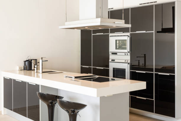 istock Modern white and black kitchen detail with island and stools 1181208738