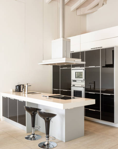 istock Modern white and black kitchen detail with island and stools 1181208837