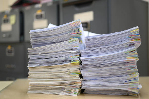 istock Stack of documents placed on the desk at the office for recycling. 1181209208