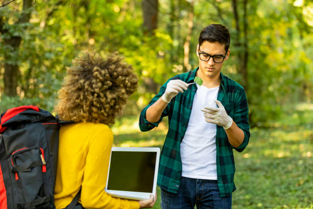 istock Scientist ecologist in the forest take samples of plants. 1181209210