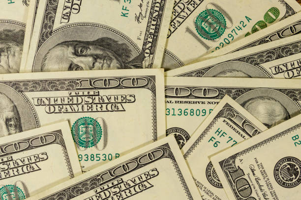 istock Background of one hundred dollar bills 1181209726