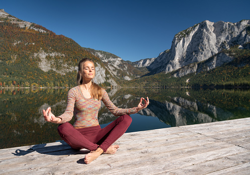 Yoga Meditation, Relaxing in Nature, Austrian Alps Panorama, Lake Altaussee. Stunning Fall colors. Nikon D850. Converted from RAW.