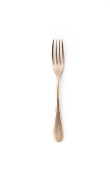 istock gold fork on isolated white background 1181214750