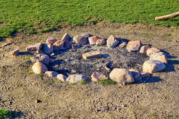 A place for a fire laid out with stones on the ground. Top view.