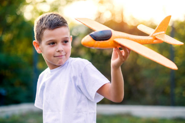 Free Stock Photo of Boy Playing With Toy Airplane | Download Free ...