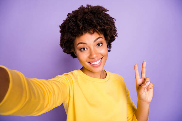 self-portrait of her she nice attractive charming lovely winsome positive cheerful cheery wavy-haired girl showing v-sign isolated over violet purple lilac pastel color background - silence curly hair facial expression female imagens e fotografias de stock