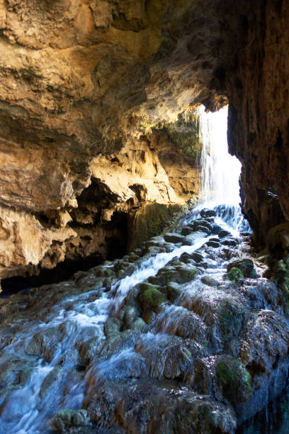 istock View of the waterfall from the cave inside 1181217654