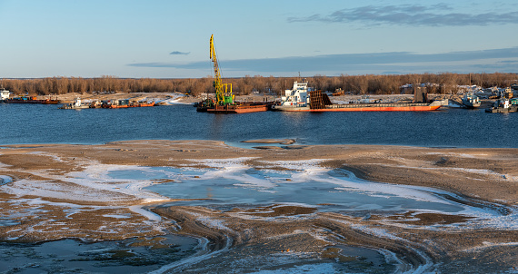 Yakutsk, Yakutia, Sakha Republic/Russia-October 13 2019: Preparation of river vessels for winter.  Recovery vessels on coastal winter parking