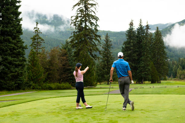 istock Golfers surveying the fairway 1181219426