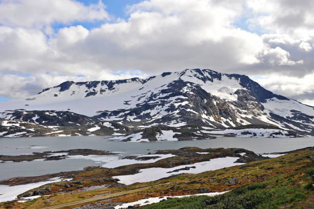 istock Snowy mountains with cloudy sky, natural park in Norway 1181219449