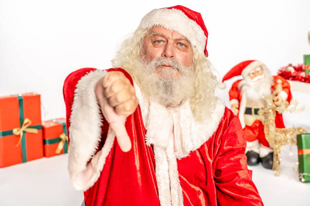 jultomten med tummen ner skylt - santa hat bildbanksfoton och bilder