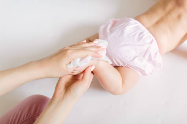 istock Mother Wiping Baby's foot 1181221387