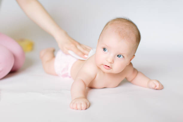 istock After shower baby wrapped into towels on the diaper table 1181221421
