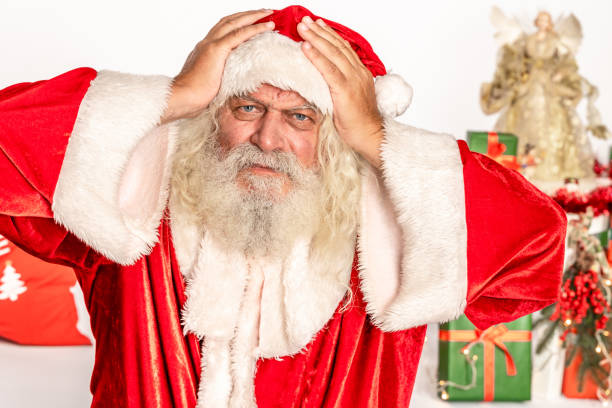 Santa Claus holding his head with two hands