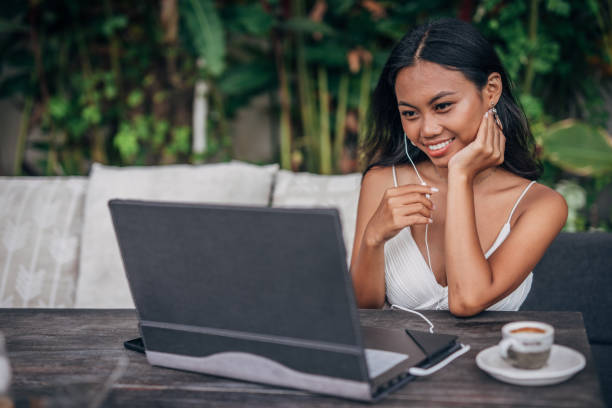 istock Woman using laptop for online chat in cafe 1181221513