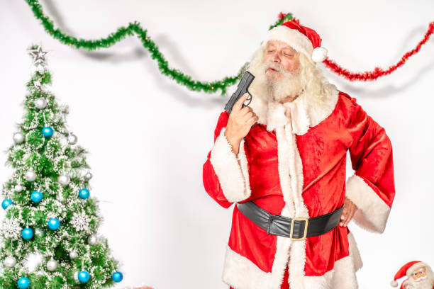 istock Santa Claus looking at  gun 1181221569