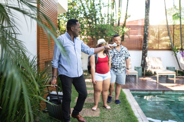 istock Host welcome special needs couple at hotel / house rental / bed and breakfast accommodation 1181221580