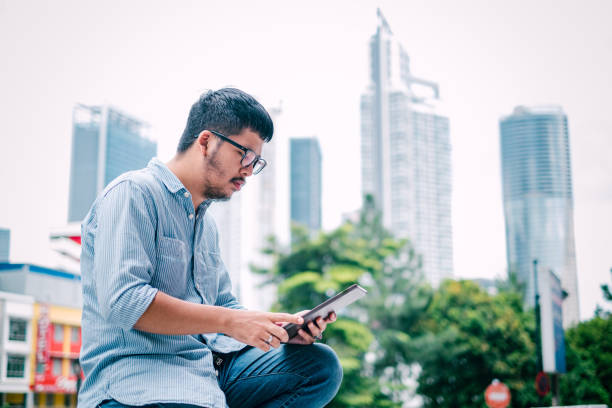 istock Young Stylish Businessman Using Digital Tablet 1181224368