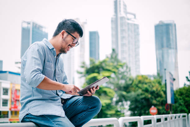 istock Young Stylish Businessman Using Digital Tablet 1181224398