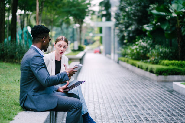 istock Two Young Business Person Discussing Their Business Project 1181224805