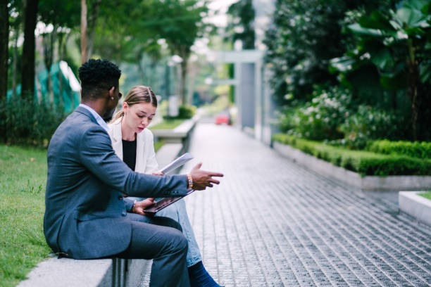 istock Two Young Business Person Discussing Their Business Project 1181224889