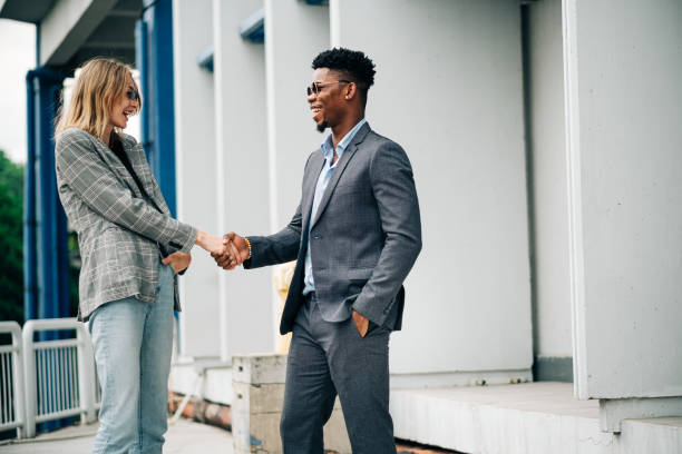 istock Two Young Business Person Shaking Hand 1181224968