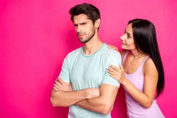 Photo of Photo of funny couple guy blaming lady in cheating standing angry and mad waiting apologizing wear casual clothes isolated vibrant pink color background