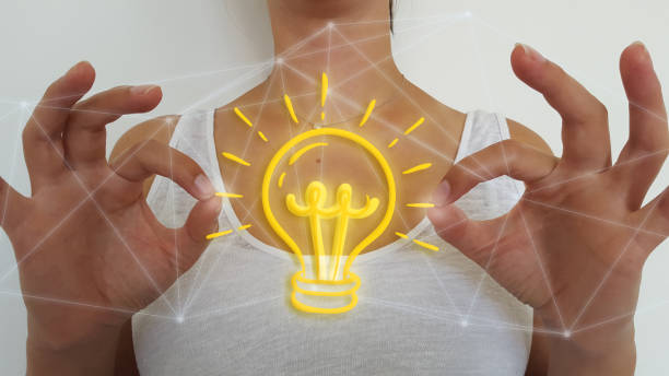 istock Businesswoman using light bulb with network connections 1181227654
