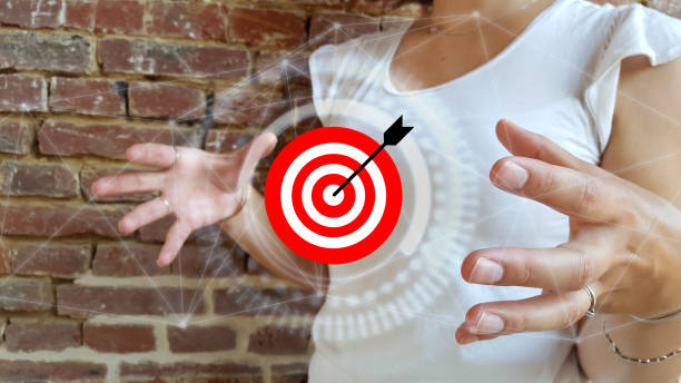 istock Businesswoman using digital target and arrow 1181227656