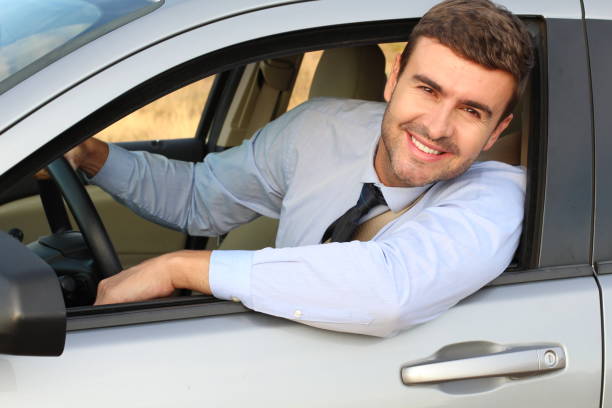 istock Elegant male driver with a gorgeous smile 1181229616