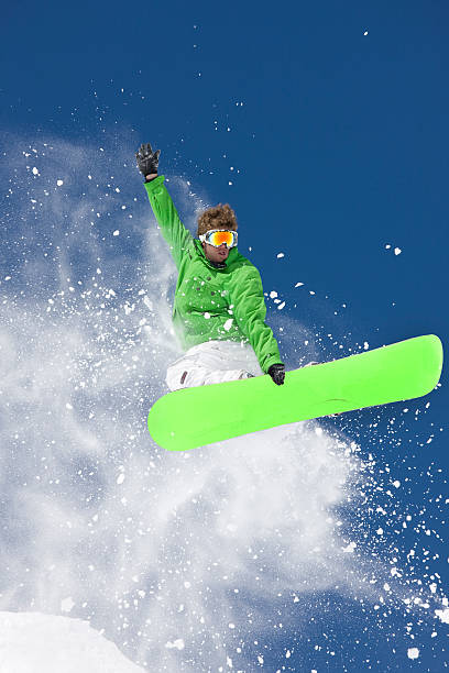 istock Snowboarder Grabbing Board In Extreme Jump 118123277