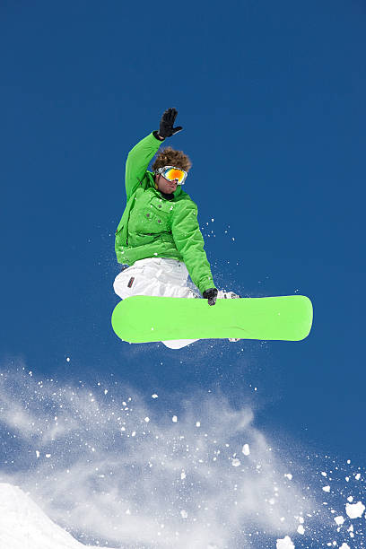 istock Snowboarder Making Extreme Jump Against Blue Sky 118123300