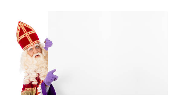 istock Sinterklaas or saint Nicholas holding blank cardboard 1181234961