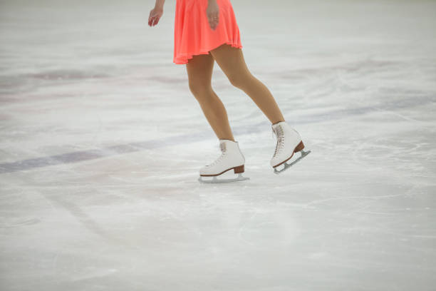 istock Figure skating, ice skating training. Feet skater on the ice 1181236601