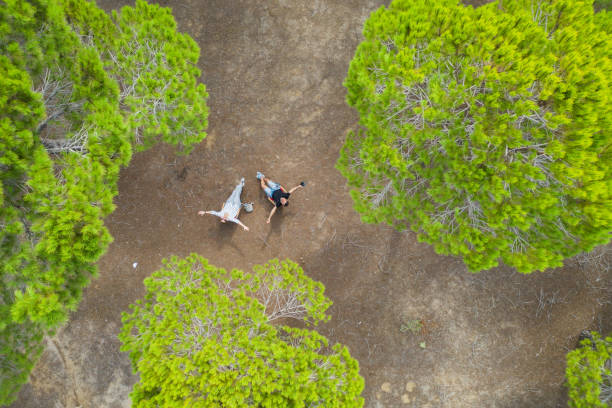 Happy couple spending time in forest.