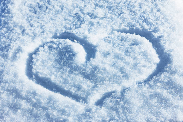 istock Heart painted in white snow 1181236820