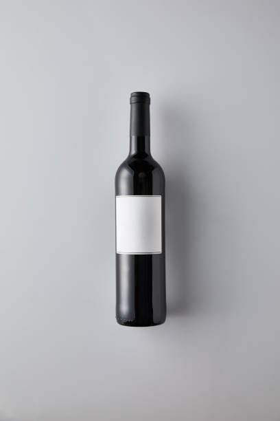istock top view of bottle with red wine and blank label on white background 1181238698